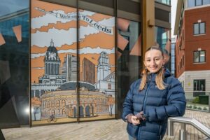 People of Wellington Place: Holly Prosser in front of her artists window